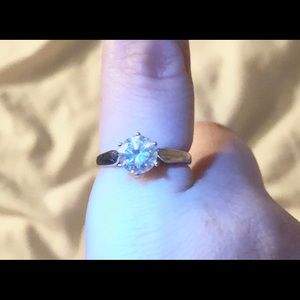 Moissanite and white gold ring